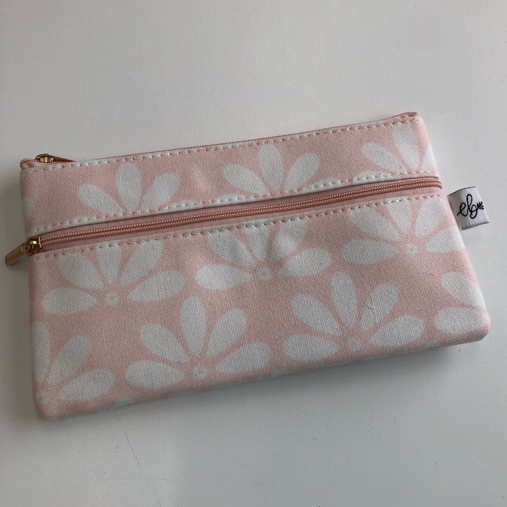 Adorable pink with white flowers makeup bag.